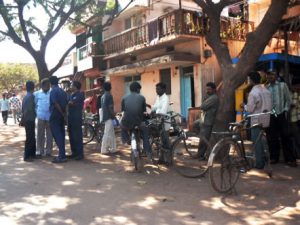 Men standing, watching and waiting.