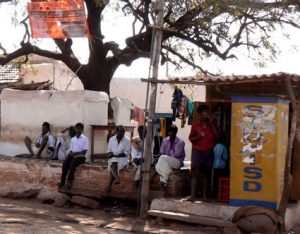 Small rural shop with men waiting.