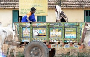 Local transportation for rural farmers is a colorfully painted wagon.