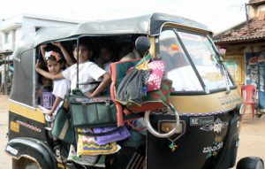 School kids pack into an auto-rickshaw