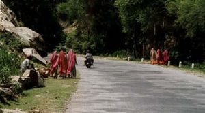 Women walking home from road repair work