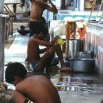 Bombay Juhu Beach workers morning wash-up