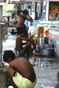 Bombay Juhu Beach workers morning wash-up