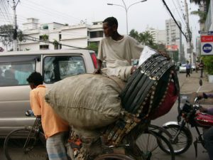 Dhaka - rikshaws often carry more than their own weight