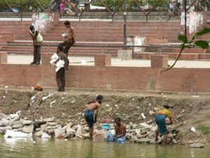 Dhaka - bathing in a city pond.