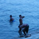 Dhaka - bathing in the river after work.