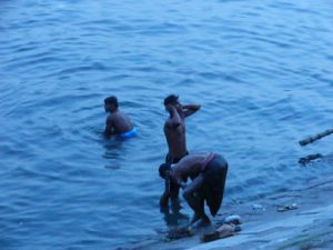 Dhaka - bathing in the river after work.