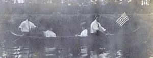 Photo from John's album; John on left in canoe,  possibly