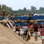 Khulna port - unloading a sand