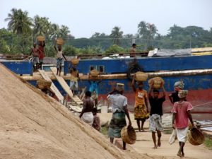 Khulna port - unloading a sand