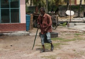 An old farmer makes his way