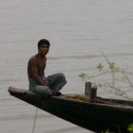 Mongla boat driver waits for business.