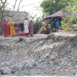 Mongla town scene - river edge at low tide