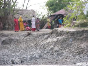 Mongla town scene - river edge at low tide