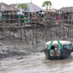 Mongla town scene - river edge at low tide