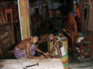 Mongla town scene - furniture shop with young