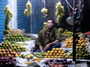 Mongla town scene - fruit stand at night