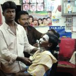 Mongla town scene - barber shop (shaving cream on his