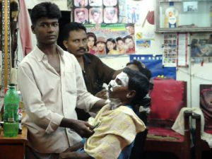 Mongla town scene - barber shop (shaving cream on his