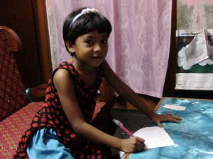 Mongla town scene - doing her school homework