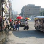 Downtown pedestrians huddle for safety crossing