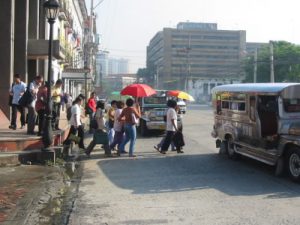 Downtown pedestrians huddle for safety crossing