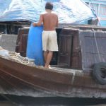 The Mekong Delta man working on boat