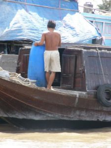 The Mekong Delta man working on boat