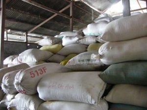 Mekong Delta - stacks of rice bags in a processing