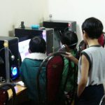 Dalat - kids playing video games in a computer shop