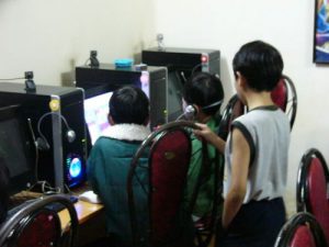 Dalat - kids playing video games in a computer shop