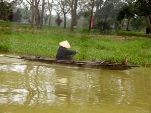 Going down the Huong River; riding