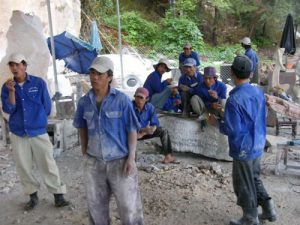 Workmen sculptors at Marble Mountain are