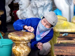 Women put finishing touches on carvings