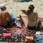 Male and female couples enjoy the clean beaches and warm