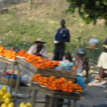 Returning from Jacmel - roadside fruit vendors (fuzzy picture taken