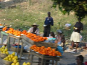 Returning from Jacmel - roadside fruit vendors (fuzzy picture taken