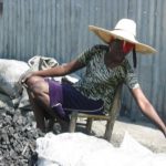 Street vendor with hat in chair