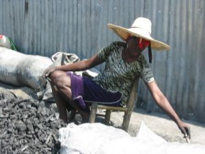 Street vendor with hat in chair