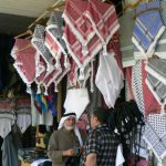 Amman - head scarf (keffiyeh) vendor;  a keffiyeh is a