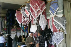 Amman - head scarf (keffiyeh) vendor;  a keffiyeh is a