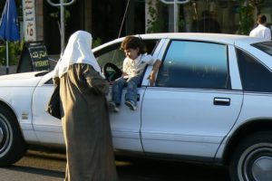 Amman - Woman with child in car window