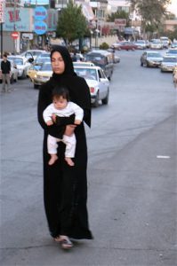 Amman - mother and child walking in the road