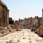 Great corinthian columns line the road