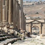 Great corinthian columns line the road