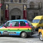 Taxi with advertising colors