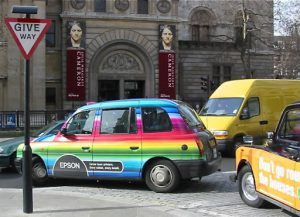 Taxi with advertising colors