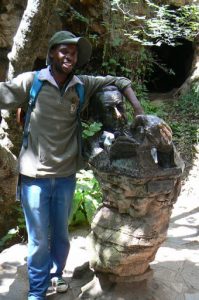 Sterkfontein Caves cheerful guide leaning on a statue of Dr