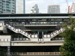 Thailand, Bangkok - a SkyTrain station with morning commuters
