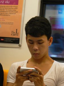 Thailand, Bangkok - on the SkyTrain virtually every young person